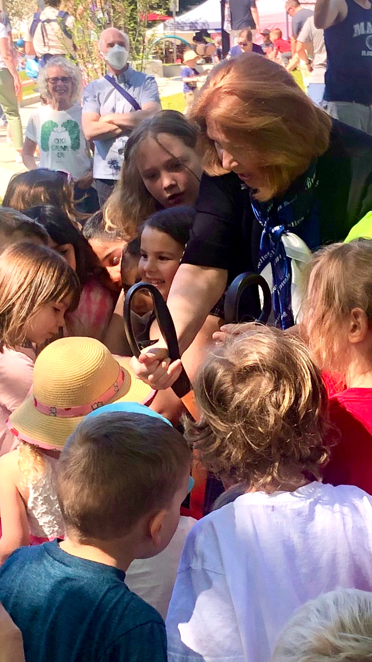 Vancouver Mayor Anne McEnerny-Ogle leaning in with children at the opening of Esther Short Park's all-inclusive accessible playground, Vancouver WA